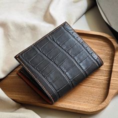 Men's leather Alligator bifold wallet  Thank you for your trust in ordering from us. We appreciate your expressions of appreciation and are especially grateful for the recent wallet order. Hope that our products will bring good luck to you. Thank you for choosing our store to supply your needs. We look forward to sharing your success. 1) Product Description: Dimensions: approx. 110mm x 95mm Color: Dark Grey Material: Outer - Alligator Leather Interior - Alligator Leather Made in Vietnam. 2) Shipping and handling: - We will send through the shipping unit of the shipping enterprises in Vietnam. - After receiving your order, we will take 5 to 7 days to process the product and then ship it to you. - It will take 10-20 days to arrive - Contact us if you need a faster delivery service - Orders p Luxury Brown Trifold Wallet As Gift, Luxury Brown Trifold Wallet Gift, Business Bifold Wallets With Crocodile Pattern, Leather Bifold Card Holder With Crocodile Pattern, Bifold Wallet With Crocodile Pattern For Gift, Bifold Wallet With Crocodile Pattern As Gift, Crocodile Pattern Bifold Wallet As A Gift, Gifts For Him Birthday, Birthday Gifts For Men