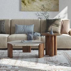 a living room scene with focus on the couch and coffee table in the foreground