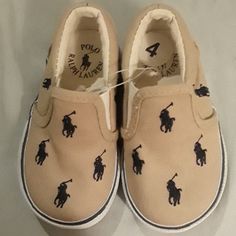 Tan Canvas Polo Ralph Lauren Printed Logo All Around Brown Casual Sneakers With Soft Sole, Casual Brown Sneakers With Soft Sole, Casual Cream Sneakers With Soft Sole, Casual Brown Sneakers For Playtime, Black Toddler Shoes, Pony Sneakers, Ralph Lauren Kids Boys, Polo Ralph Lauren Shoes, Polo Shoes