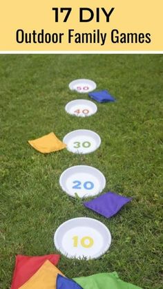 an outdoor family game with colorful paper plates and numbers on the grass in front of it