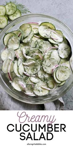 a bowl filled with cucumber salad on top of a table