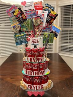 a birthday cake made out of coca - cola cans