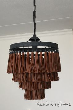 a chandelier with fringes hanging from the ceiling