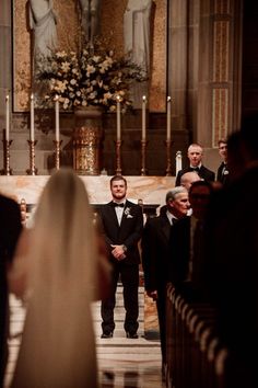 the bride and groom are walking down the aisle at their wedding ceremony in st louis cathedral