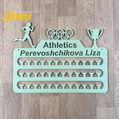 a metal plaque with the words athletics, perovoskiova laza on it