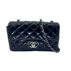 This Chanel Flap Rectangle Shoulder Bag Is A Stylish Addition To Any Fashion-Forward Woman's Collection. It Features A Turn-Lock Closure, Silver Handle/Strap Accents, And Gold Hardware. The Black Patent Leather Exterior Is Quilted And The Bag Has A Rectangular Shape, Measuring 4.7 Inches In Width, 7.8 Inches In Height, And 2.3 Inches In Depth. This Mini Bag Is Perfect For Carrying Your Essentials And Is Made Of High-Quality Leather. It Is Part Of The Chanel Flap Product Line And Is A Must-Have For Any Fan Of The Brand. The Bag Is Pre-Owned And Has Been Well Taken Care Of. Get Your Hands On This Chic Shoulder Bag Today! Good Pre-Owned Condition. Includes Authenticity Card. Chanel Mini Rectangular, Navajo Blanket, Blanket Fabric, Embroidered Clutch, Chanel Mini, Blue Crochet, Chanel Bags, Black Patent Leather, High Quality Leather