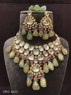 Sabyasachi Inspired Designer Kundan Set, Green Kundan Choker, Kundan Bridal Choker Set, Kundan Bridal Set Sabyasachi inspired kundan choker set with a twist of Tanjore hand-painted beads perfect for brides. Color of the tanjore beads can be custozmied Details: > Premium quality kundans used with back meenakari > Hand-painted tanjore beads in unique irregular shapes > tiny Onyx beads to enhance the beauty > Color of the tanjore & onyx can be customized. Please message us for more info. Feedback: Bridal Choker Set, Kundan Choker Set, Hand Painted Beads, Kundan Jewellery Set, Kundan Choker, Bridal Choker, Irregular Shapes, Kundan Set, Polki Necklace