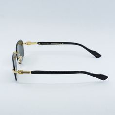 Introducing the Gucci GG1221S 001 Gold/Black/Grey sunglasses, a luxurious and sophisticated addition to your eyewear collection. Exclusively available at OSSA FRAMES, these designer glasses are sure to make a statement with their sleek design and high-quality craftsmanship. Crafted from premium metal, the frame of these sunglasses boasts a stunning gold finish that exudes elegance and glamour. The rectangular shape of the frame adds a contemporary touch to the design, making them perfect for the modern man who values both style and practicality. The subtle black accents on the temples add a touch of sophistication to the overall look. The lenses of the Gucci GG1221S sunglasses feature a chic grey tint that not only protects your eyes from harmful UV rays but also adds a touch of mystery an Gucci Tinted Sunglasses For Formal Occasions, Gucci Luxury Sunglasses For Formal Occasions, Luxury Gucci Sunglasses For Evening, Luxury Rimless Sunglasses With Mirrored Lenses, Elegant Black Rimless Sunglasses, Luxury Rimless Sunglasses With Tinted Lenses, Luxury Polarized Sunglasses, Gucci Rimless Mirrored Sunglasses, Luxury Rimless Polarized Sunglasses