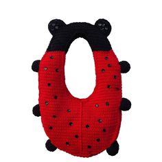 a red and black crocheted animal shaped object