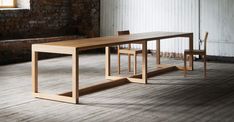 Frame Dining Table by Nikari, showing frame dining table in live shot. Minimal Bed Frame, John Pawson, Bed Frame Design, British Furniture, Wooden Screen, Column Design, Sit Stand Desk, Table Frame, Swedish Design