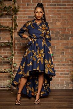 This Rahyma Classic High-Low Wrap dress Jacket is a versatile piece of Art. You can wear it as a wrap dress or as a Jacket. It is enriched with beautifully crafted details, from the front side pockets, military style shoulders, back flap and shoulder pads. It comes with a 3/4 sleeve length and the upper part is lined with 100% cotton. It is made with 100% wax print cotton, this is a piece to wear with pride. Since measurement of sizes may be slightly different from brand to brand, It is very imp African Clothing Stores, Afrocentric Clothing, Afrocentric Fashion, African Print Clothing, African Inspired Clothing, Designer Midi Dresses, Casual Wear Dress, African Fashion Women Clothing, Chiffon Midi Dress