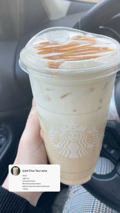 someone is holding up a starbucks drink in their hand with caramel on the top