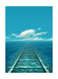 a long pier extending into the ocean under a blue sky with clouds and sun beams