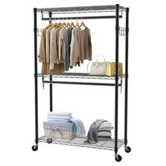 a metal rack with clothes and bags on it