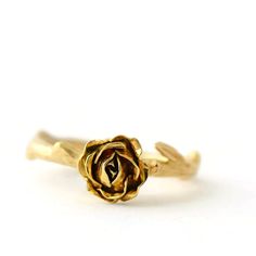 Yellow Gold Rose Ring, Flower Engagement Ring, Solid Gold Ring For a romantic engagement ring look no further than this classic Rose design. The design features an open handmade fair-trade gold rose supported by a smooth stem. * Material: 9ct Fair-trade Gold (Choose from Yellow, Red or White) * Size of Rose: Approx. 0.8cm (0.3in) diameter and 0.4 cm (0.16 in) height * Made to order * Ready to Ship in 10 business day * Made in the United Kingdom Please allow for slight variations in size as every Dainty Rose Design Flower Ring For Anniversary, Elegant Floral Rings With Rose Details, Elegant Gold Rings With Rose Details, Rose Flower Ring For Wedding, Delicate Rose Design Flower Ring For Wedding, Yellow Gold Flower Ring With Rose Design For Wedding, Yellow Gold Wedding Jewelry With Roses, Yellow Gold Jewelry With Roses For Wedding, Yellow Gold Rose Jewelry For Wedding