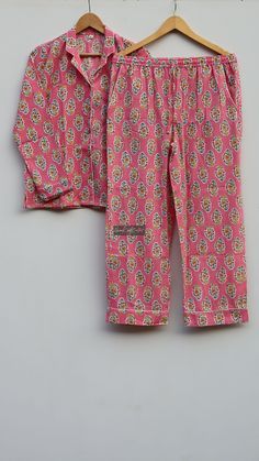 Designed and customized in our India store, the love and care we put into every PJ will stand out to you at the moment you see it. Full sleeve shirt with buttons and loose fit trousers. Completely handmade in Jaipur from 100% pure cotton fabric. Comes in S/M/L/XL sizes, but without any complications can be adjusted to individual measurements. Note: The color and brightness of actual product may vary due to digital photography and photo editing. We crossed check each and every product before list Pant Pajama Design, Pink Matching Sleepwear Set For Bedtime, Pink Matching Set Sleepwear For Bedtime, Pink Cotton Sleepwear Matching Set, Pink Cotton Matching Set Sleepwear, Pink Bedtime Sets, Pink Matching Set For Bedtime, Night Suits Pajama Set, Cotton Night Suit