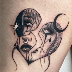 a woman's thigh with two faces in the shape of a moon and stars