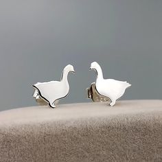 Handcrafted Sterling Silver Duck Goose Earrings - a whimsical and nature-inspired addition to your jewelry collection! Choose your preferred style and material to make them truly your own. D E T A I L S * Listing is for one pair earrings(2pcs). * Style Options: 🌟Mismatched Duck and Goose:  A playful combination of duck and goose earrings, perfect for those who love a mix of charm and character 🌟Geese Earrings:  Embrace the elegance of a pair of geese, symbolizing grace and harmony. 🌟 Duck Ear Goose Earrings, Silver Fish-shaped Sterling Silver Earrings, Silver Bird-shaped Earrings For Pierced Ears, Bird-shaped Jewelry Set With Matching Earrings, Handmade Sterling Silver Bird-shaped Jewelry, Subtle Luxury, Hand Stamped Jewelry, Stamped Jewelry, Sterling Silver Earrings Studs