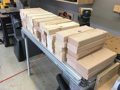 several pieces of wood sitting on top of a workbench in a garage area