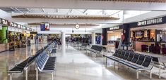 there are many empty benches in the airport