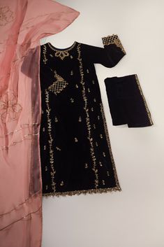 Designed on pure black velvet with intricate hand/ada work, “ Black Velvet “ is paired with matching embellished flappers alongside a pure coral organza dupatta featuring Gotah craftsmenship. The length of the kameez is 48 inches. Order Duration: 4 to 6 weeks Pakistan Suit, Long Kameez, Agha Noor, Dress Book, Pakistani Fancy Dresses, Pakistani Dresses Casual, Pakistani Fashion Party Wear, Beautiful Pakistani Dresses, Mode Abaya