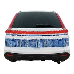 the back end of a white car with red, white and blue stripes