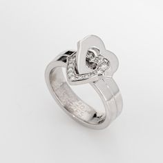 This is part of Chairish’s Fine Jewelry assortment.  Pre-owned Cartier double heart diamond ring crafted in 18k white gold (circa early 2000s).    Diamonds total an estimated 0.15 carats (estimated at G-H color and VS1-2 clarity).   The sweet double heart design is set with diamonds to one of the hearts. The ring is a smaller size (EU 47 or US 4) and is great worn on the pinky finger. Dating to the early 2000s the ring is an out of production Cartier design. The ring does not come with Cartier p Luxury Heart Shaped Diamond Ring For Formal Occasions, Formal Heart Ring With Brilliant Cut, Formal Heart Shaped Cubic Zirconia Diamond Ring, Luxury Heart-shaped Diamond Ring With Accents, Luxury Heart-shaped Brilliant Cut Diamond Ring, Luxury Heart Shaped Ring For Formal Occasions, Formal Diamond White Heart Cut Ring, Valentine's Day White Gold Cubic Zirconia Diamond Ring, Heart Cut Single Diamond Rings For Anniversary