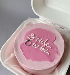 a pink cake with the word bride to be written on it