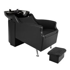 a black chair with a white sink and footstool