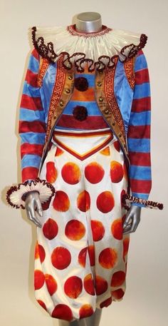 a mannequin dressed as a clown with red and blue stripes on it's body