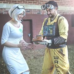 a man and woman dressed up in costumes