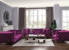 a living room filled with purple couches and chairs