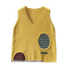 a yellow sweater with a patch on the chest and two holes in the front,