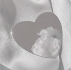 a heart - shaped box with cotton in it