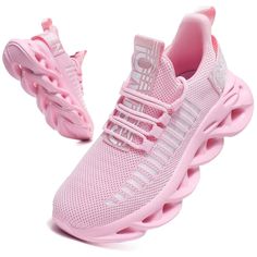 a pink sneaker is shown with the bottom part showing and upper part in white