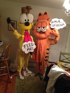 two people in costumes standing next to each other with speech bubbles above their heads that say feed me