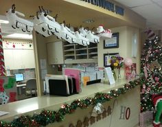 an office decorated for christmas with decorations