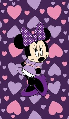 minnie mouse flying through the air with hearts in the background and purple polka dot bow on her head