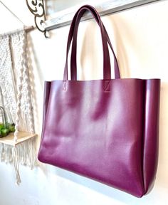 "This is our extra large purple leather bag, the oversized work and travel computer bag. It's supper sturdy bag made with thick firmer leather. All our bags are made to order. Production time is 3-5 business days, up to 7 days for custom orders. Add lining to any of our bags https://www.etsy.com/listing/891051352 ❗️Measurements: ❗️ 24\" W(top opening ) x 15\"H 19\"wide base x 5\"D Strap drop 11\" Weight 3 lbs FUNCTIONALITY: * This bag is roomy and stylish, great for your weekend getaway, perfect Purple Leather Rectangular Bag, Purple Leather Tote Shoulder Bag, Large Capacity Purple Bag For Everyday Use, Purple Leather Bag For Daily Use, Modern Purple Bag For Everyday Use, Purple Leather Shoulder Bag For Everyday, Modern Purple Bags For Everyday Use, Everyday Purple Leather Shoulder Bag, Purple Tote Bag For Office