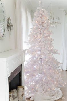 a white christmas tree in a living room