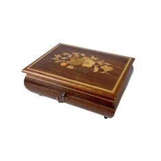 a wooden box with floral designs on it