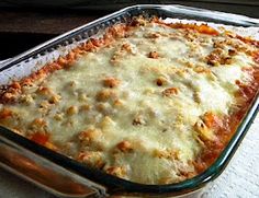 a casserole dish filled with meat and cheese