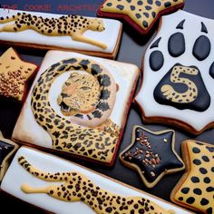 decorated cookies are arranged in the shape of leopards and cheetah's