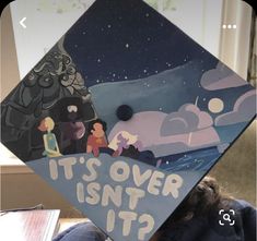 a child wearing a graduation cap that says it's over isn't it?