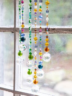 a window with beads hanging from it's side