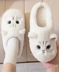 This kitten slipper is both cute and comfy. Sure to be a fave for all cat lovers. Comes in four fabulous colors from which to choose. Made with PVC cushiony sole and plush material. *Please see the size chart when choosing your size. Cute Fluffy Slippers With Round Toe, Cute Flat Winter Slippers, Cute Flat Slippers For Winter, Kawaii Soft Slippers With Round Toe, Cute Fluffy Slippers For Indoor Use, Cute Fluffy Indoor Slippers, Cute Soft Synthetic Slippers, Cute Soft Slip-on Slippers, Cute Soft Flat Slippers