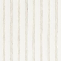 a white and beige striped wallpaper with vertical stripes