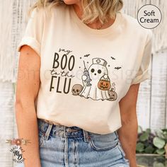 Retro Say Boo to the Flu Nurse Ghost Halloween Vaccine T-Shirt Spooky Vibes Immunizations Travel Clinic Tee Retro Spooky Vibes Front Back Office Gift Fall Spooky Pharmacist Shirt Flu Shot Season Vaccine Squad Tee FLiRT Booster Outreach Shirt Funny Halloween Healthcare Tee XS up to 5XL Our Bella + Canvas 3001 unisex shirt is a soft, boyfriend style tee. It has a comfortable and relaxed fit. It is flattering for both men and women. Perfect for active and leisure wear.  *Original design *Sizes are Healthcare Halloween Shirts, Halloween Nurse Shirt, Cricut Nurse, Pharmacist Shirt, Nurse Team, Soft Boyfriend, Halloween Nurse, Spooky Vibes, Nurse Shirt