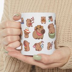 a woman holding a coffee mug with bears on it