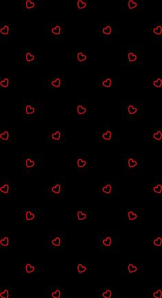 a black background with red hearts on it